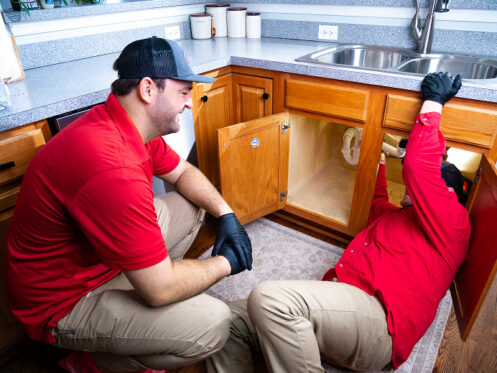Miller's services plumbers repairing kitchen sink