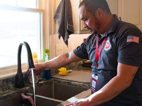 Miller's services plumber running water from a kitchen sink