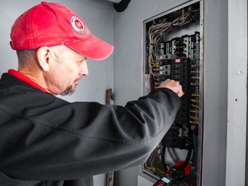 Miller's services electrician servicing electrical panel