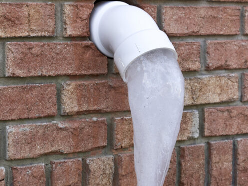 Pipe with frozen water coming out of it